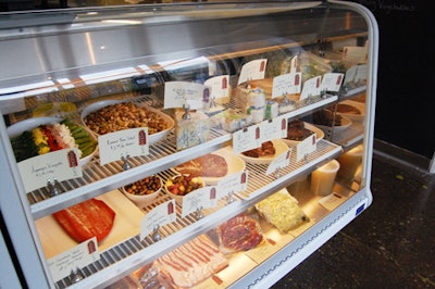 The deli counter features a selection of house-made pâtés and terrines, salads, cured and smoked fish, and deli meats.