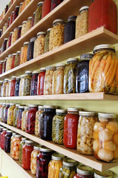 Mason jars filled with preserves decorate the space.