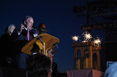 Mayor Michael Bloomberg led the crowd in a chorus of 'Happy Birthday to You' while sparklers lit the bridge-shaped cake.