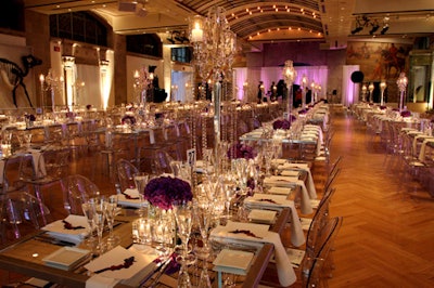 The dining room included mirrored tables and purple lighting, along with an event program at every table setting.
