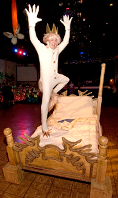 Throughout dinner a King Max performer danced and jumped merrily upon a bed to amuse guests.