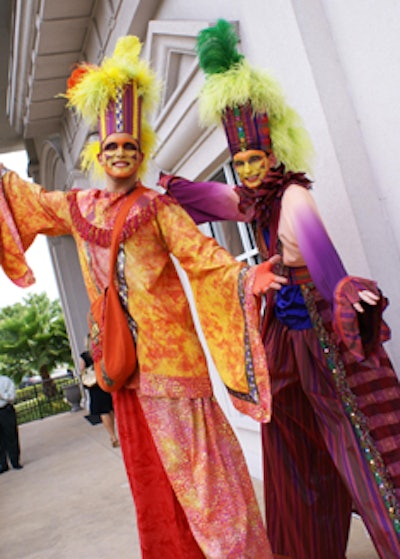 A menagerie of colorful, playful stiltwalkers greeted guests as they arrived at the A La Carte Event Pavilion.