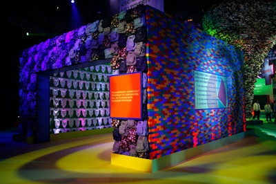 Statistics about education and poverty in New York and famous quotes from writers like Thomas Carlyle punctuated each sculpture, including a structure made from JanSport backpacks, baby onesies, and Lego-like blocks.