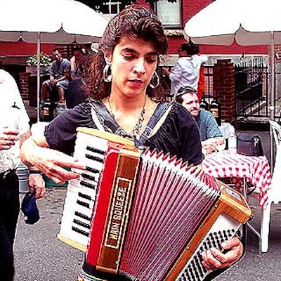 Musician and singer Rachelle Garniez strolled up and down the block performing Italian melodies on the accordion.
