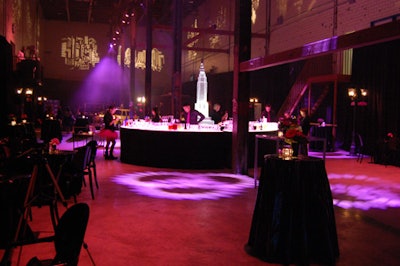Pink lighting, projections of the New York skyline, and a central circular bar filled the space dressed by McNabb Roick Events.