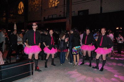 Male servers dressed in black shirts with pink ties and matching tutus greeted guests and passed hors d'oeuvres throughout the evening.