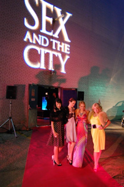 Four models posed on the carpet outside the venue and later handed out gift bags to guests.
