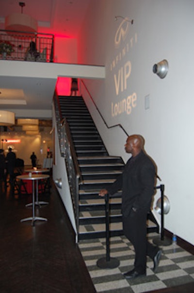 A bouncer guarded the stairs to the Infiniti V.I.P. lounge, ensuring that only bracelet-wearing guests (who had purchased $500 ticket packages) were allowed upstairs.