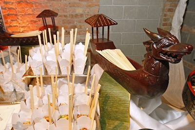 Takeout containers filled with noodles and built-in chopsticks sat beside the sushi platters.