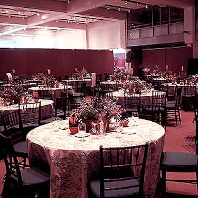 The dining area and live auction area of the event featured potted plant centerpieces by Renny Design for Entertaining.