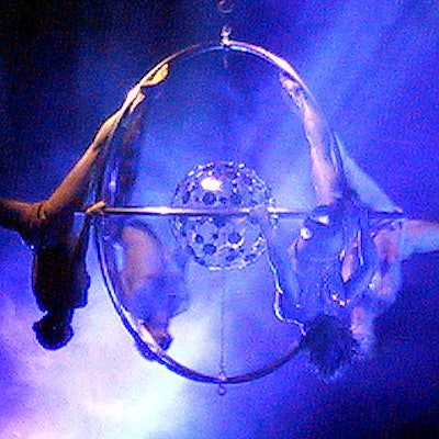 Acrobatic dance group EFX performed inside a sphere designed by the Living Art of Armando.