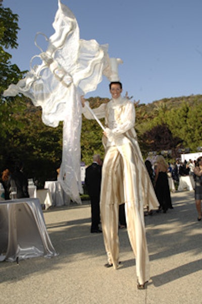 Performers in Edwardian garb circulated on stilts and skates.