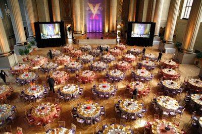 The benefit covered the tables and staging in red, gold, and purple.