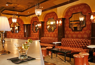 The space features a marble-topped mahogany bar.
