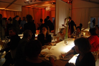 Placing dinner tables in the front section of the tent kept the rest of the space clear for moving around.