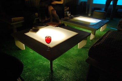 The outdoor lounge, carpeted with Astroturf, held more glowing furniture.
