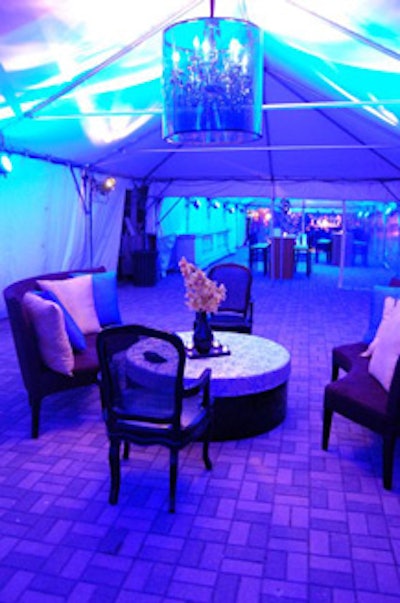 The jazz lounge featured chandeliers wrapped in sapphire blue, crystal-gel shades, and ottomans topped with flower arrangements.