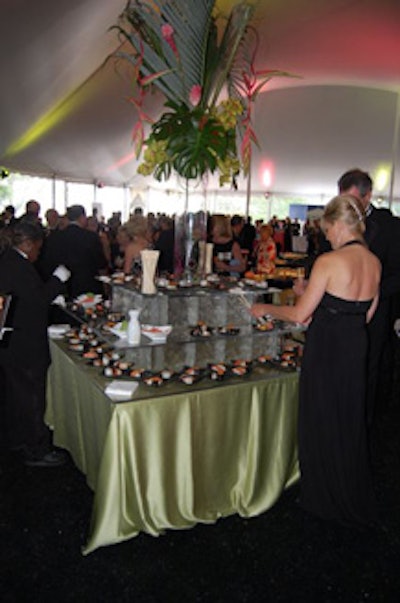 The cocktail reception, which was held in a tent that spanned the aquarium's west plaza, featured a sushi buffet and a green and coral color scheme.