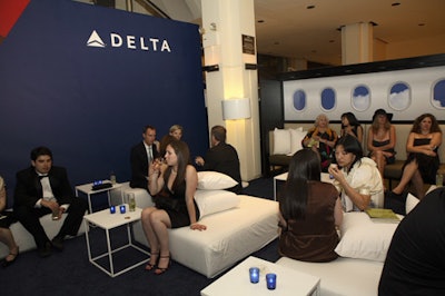Delta created a branded cocktail lounge where uniformed flight attendants served drinks off the airline's new cocktail menu.