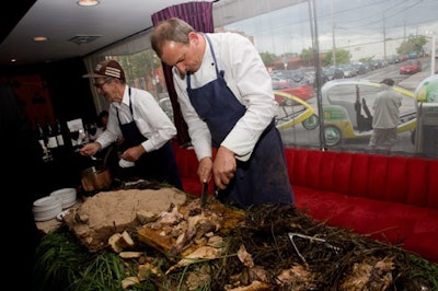 Chef Michael Stadtländer carved a whole roast pig from his Eigensinn Farm.