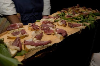 Passed hors d'oeuvres were passed on long slabs of wood to emphasize the local and organic theme.