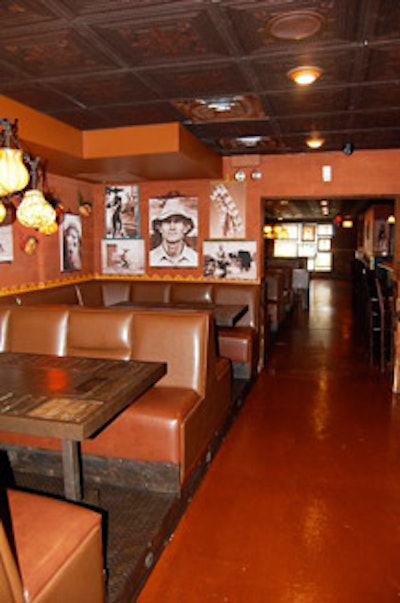 The second floor provides seating at built-in leather booths.