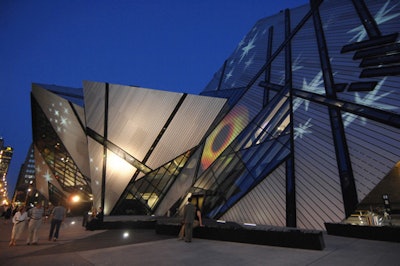 Westbury National Show Systems projected images of stars and Luminato's iris logo onto the exterior of the ROM.