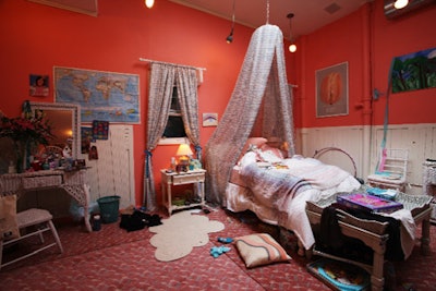 Designer Anne Koch wanted the white and pink space to serve as a polar opposite to Earnest Sewn's masculine and rustic decor.