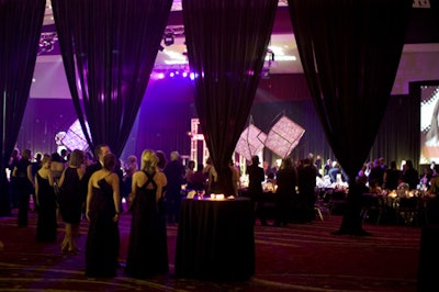 A sheer black curtain opened after the cocktail reception, dramatically revealing the dining room decor.
