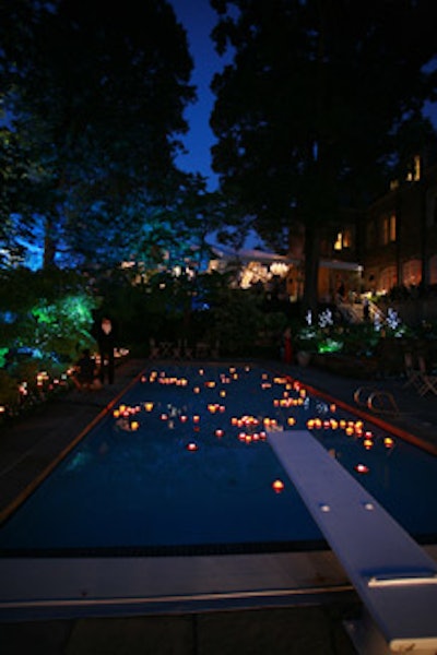 Pavillard used candlelit lillypads to turn the swimming pool into a romantic garden pond.