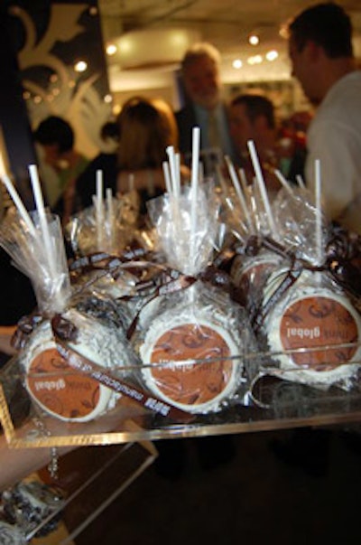 The takeaway gifts were chocolate-covered cakes on lollipop sticks; the packaging bore Global's logo.