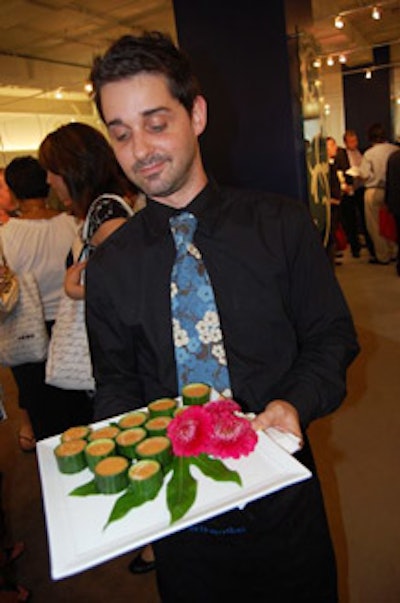 Servers' ties and vests were made with the same cherry-blossom fabric pattern that covers some of Global's new furniture.