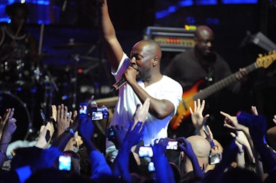 Wyclef joined the crowd on a bodyguard's shoulders during his performance.