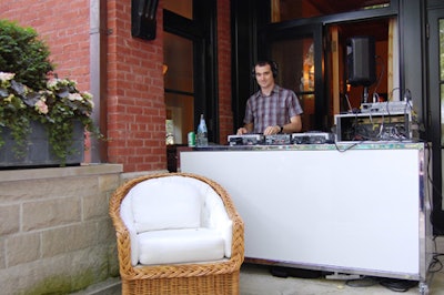 DJ Marc de Breyne spun music from his booth on the steps at the rear of the house.