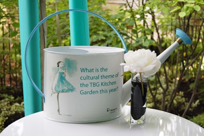 Watering cans placed on tables held trivia questions with facts about the Toronto Botanical Garden.
