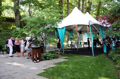 Regal Tent Productions erected a narrow white-topped tent in the 300-foot-long garden.