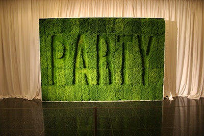 A wall of carefully manicured sod served as the backdrop for photos at the step-and-repeat.