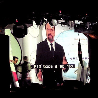 A behind-the-screen view of the Men in Black 'training video' guests viewed at the party. The video was projected onto a stretched fabric screen from Pink Inc.