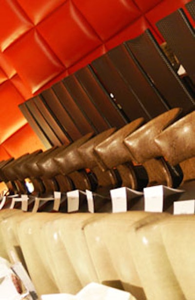 The runway was lined with leather chairs and red-cushioned temporary walls courtesy of Unique Option.