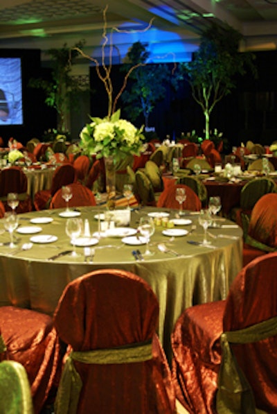 Tables were covered in organic hues like russet reds and mossy greens to create a magical forest theme.