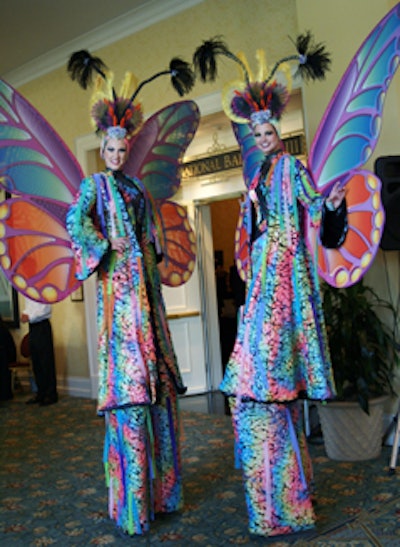 Eventgoers were greeted by larger-than-life stiltwalkers dressed as butterflies with brightly colored 54-inch wings.