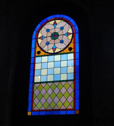 Reclaimed stained-glass windows decorate the space.
