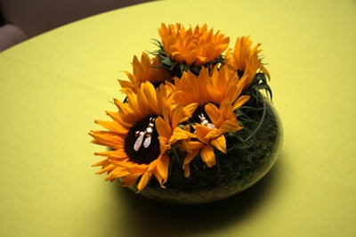 Sunflower centerpieces on some tables held bejeweled bees. Guests took home these items as part of their swag.