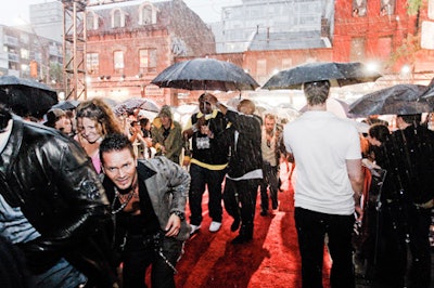 Performers arrived in the middle of a downpour on the red carpet.