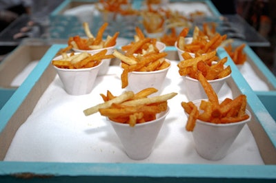 Servers offered cones of sweet-potato fries at one of the food stations inside the tent.
