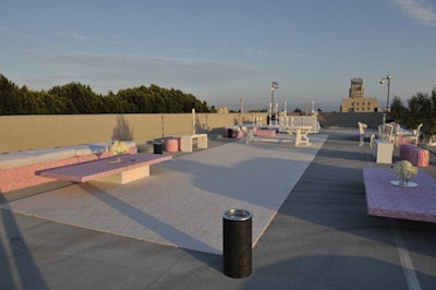 The parking structure's rooftop served as a smoking lounge with a bar.
