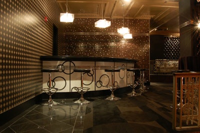 Around the perimeter of the main room are seating areas and a small bar section.