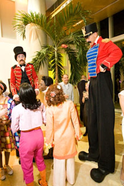 Stiltwalkers guided guests into the reception areas.