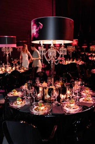 Antique lamps fitted with custom shades—each bearing the evening's fire logo—served as centrepieces.