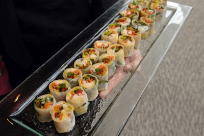 Servers passed a selection of hors d'oeuvres including rice paper rolls during the cocktail reception.